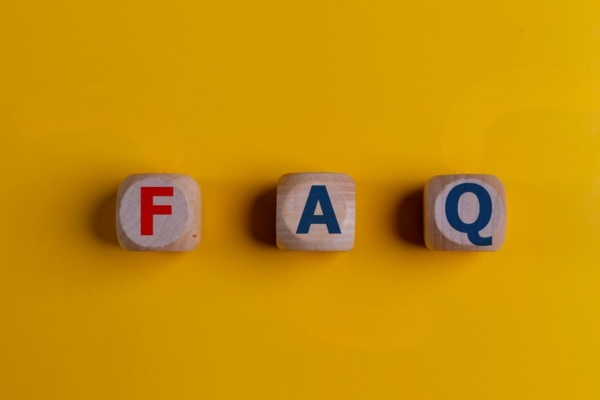 FAQ spelled using wooden letter dice depicting questions about Why does my tankless hot water heater go cold