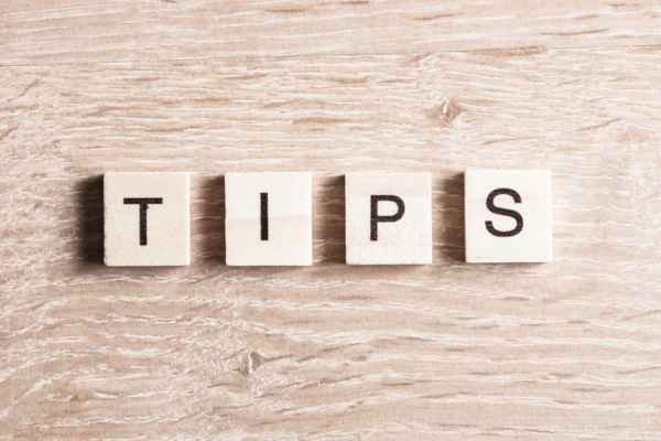 TIPS spelled using wooden letter chips depicting heating oil supplier