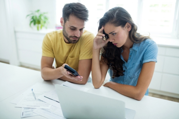 couple calculating energy savings