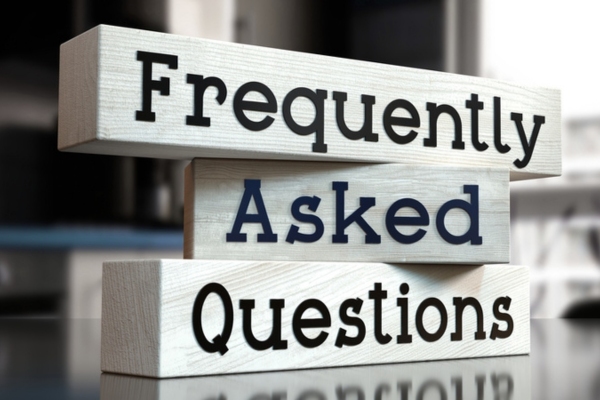 Frequently Asked Questions on wooden bars depicting Ductless Heat Pumps vs Ductless Air Conditioners Common Questions