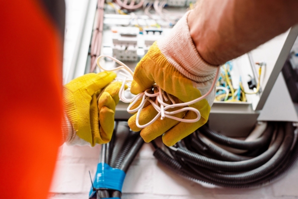 electrician inspecting a home's electrical system