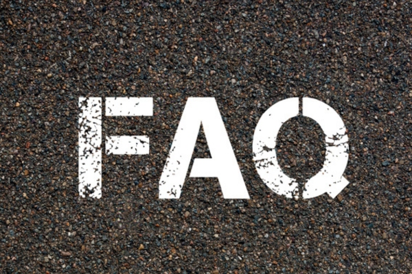 FAQ spray painted on concrete depicting questions about ductless HVAC vs window AC