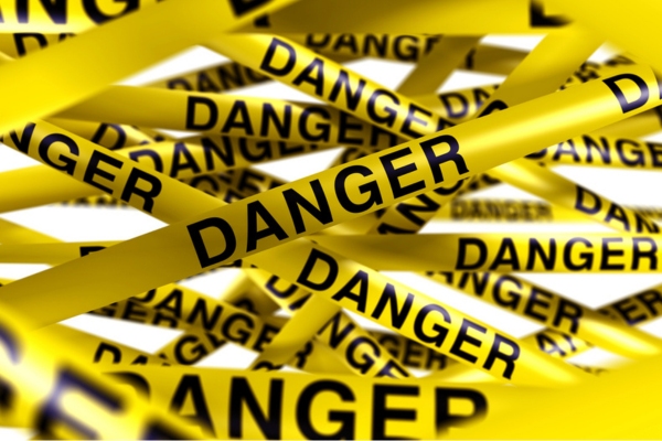 danger yellow tape depicting hazards of sewer gas in your home