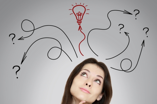 Thinking woman making decision with arrows and lightbulb doodle above her head depicting Choosing the Right Trane Furnace