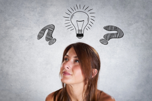 image of a woman thinking with question mark and lightbulb doodle above her head depicting choosing Trane air conditioner