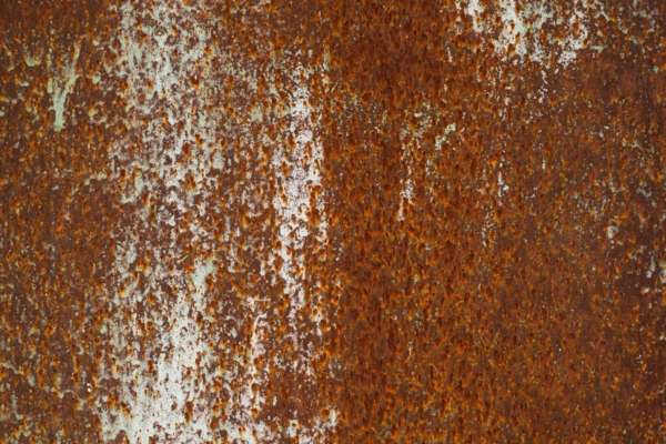 corrosion on metal surface depicting Impacts of Water Contamination in Home Oil Tanks