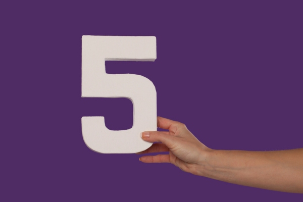 female hand holding the number 5 depicting 5 Proven Solutions for Better Home Comfort