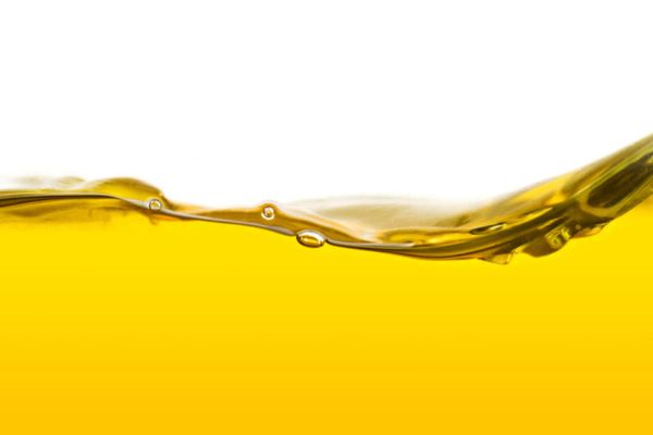 a wave of gold liquid depicting How Fuel Oil Additives Support Your System