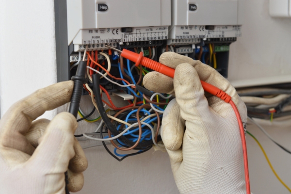 electrician working on an electrical panel