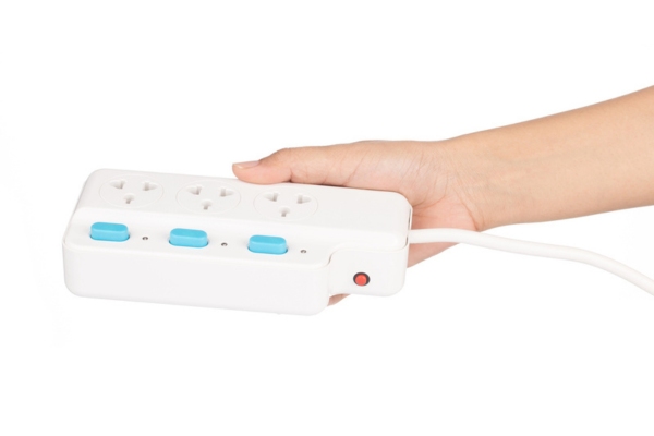 hand holding power strip