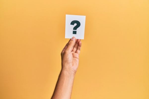 hand holding a question mark sign depicting FAQs about Smart Oil Tank Gauge