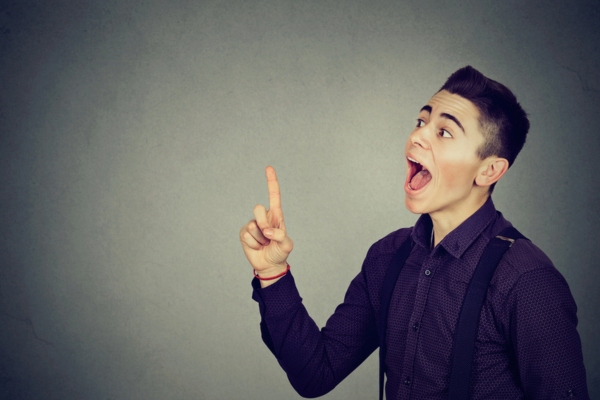 thinking man looking delighted while pointing up depicting Understanding a Smart Oil Tank Gauge