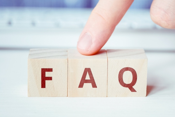FAQ spelled using wooden letter cubes depicting Mitsubishi Ductless vs Window AC Units questions