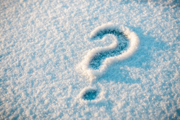 question mark doodled on snow on the ground depicting Hard Water Plumbing Problems in Winter FAQs