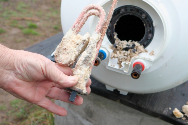 water heater part full of limescale deposits