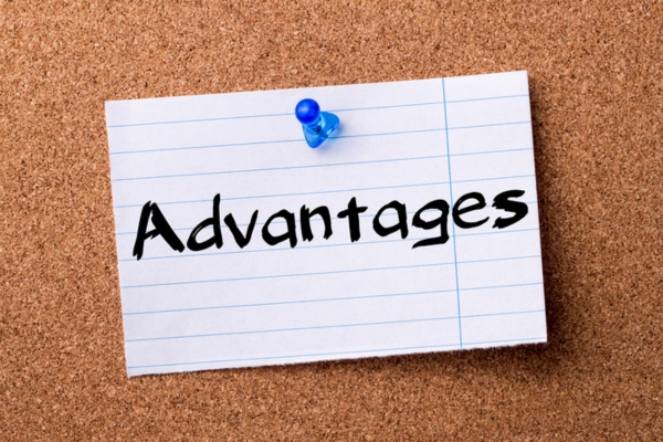 Advantages written on a torn paper pinned on a corkboard