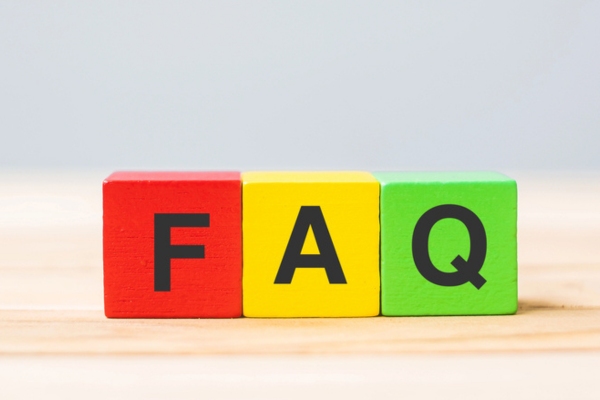 FAQ spelled using colorful wooden letter cubes depicting Air Conditioner Tune-Up questions