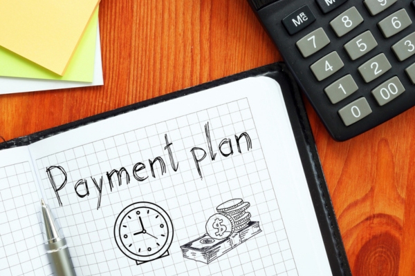 payment plan written on a notebook