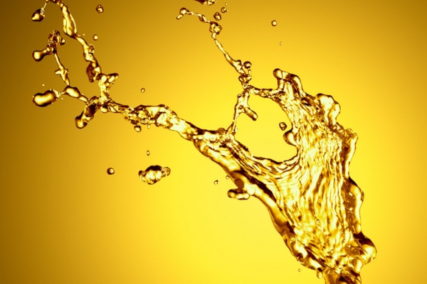 gold liquid splash depicting heating oil