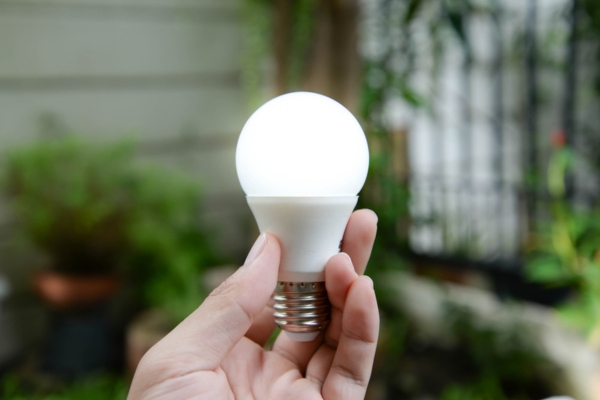 homeowner holding LED light