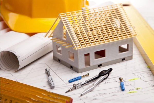miniature house plan and blueprints depicting air conditioning system Transforming Building Design