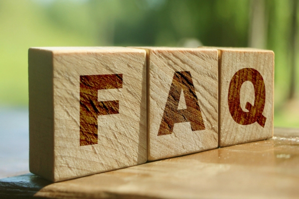 FAQ spelled using wooden letter chips depicting Summer Plumbing Concerns questions