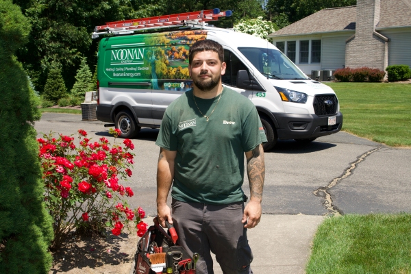 HVAC technician and Noonan Energy service van
