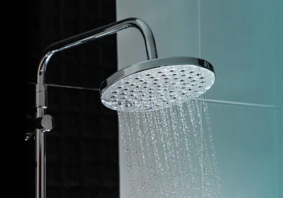 Close up of Water flowing from shower in the bathroom