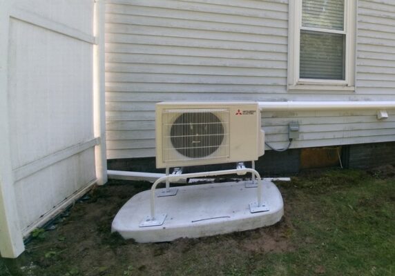 Mitsubishi ductless HVAC condenser installed outside the house