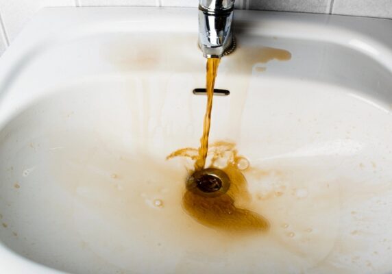 dirty water pouring from the faucet