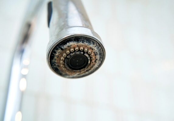 faucet covered with limescale due to hard water
